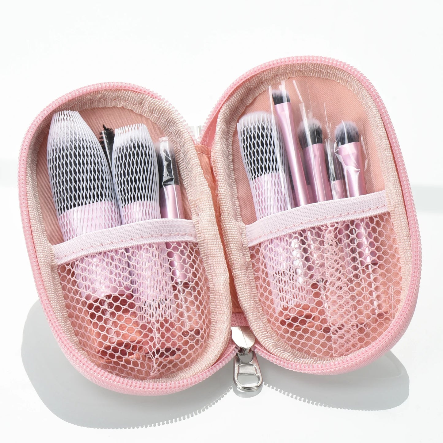 10 piece brush set with travelling pouch. Made with synthetic nylon fibers. Great for beginner makeup artists. Comes with blush brush, foundation brush, eyeshadow brush, eyeshadow smudger, eyeshadow detailer brush, angled eyebrow brush, lipstick brush and an eyebrow spoolie.