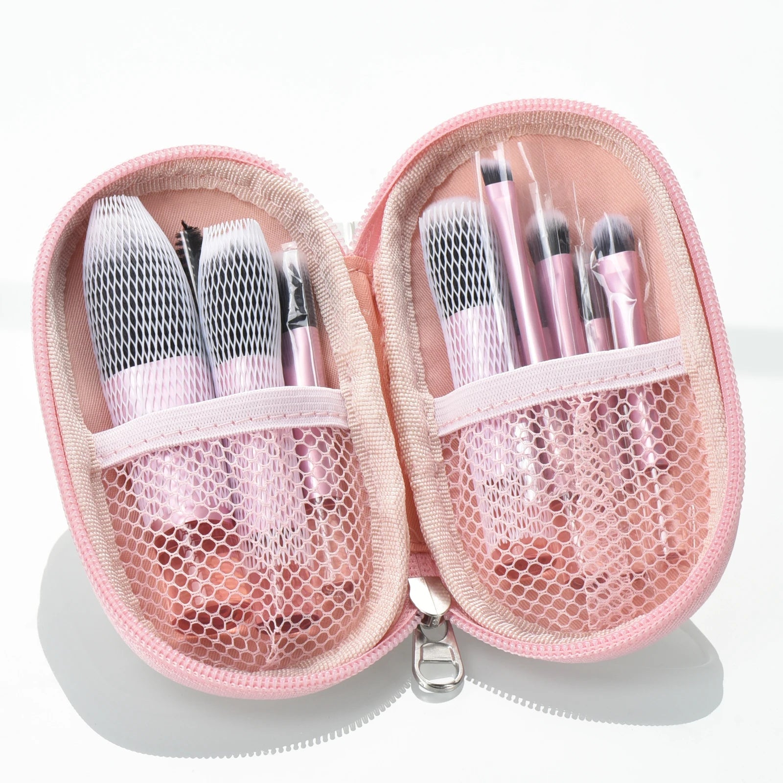 10 piece brush set with travelling pouch. Made with synthetic nylon fibers. Great for beginner makeup artists. Comes with blush brush, foundation brush, eyeshadow brush, eyeshadow smudger, eyeshadow detailer brush, angled eyebrow brush, lipstick brush and an eyebrow spoolie.