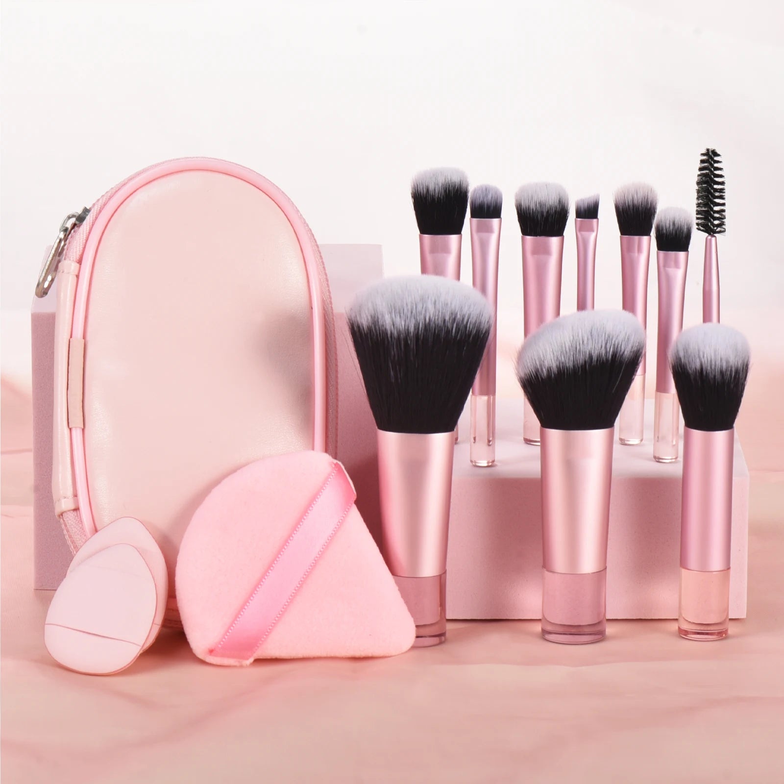 10 piece light pink travel makeup with pouch. Made with synthetic nylon fibers. Great for beginner makeup artists. Comes with blush brush, foundation brush, eyeshadow brush, eyeshadow smudger, eyeshadow detailer brush, angled eyebrow brush, lipstick brush and an eyebrow spoolie.