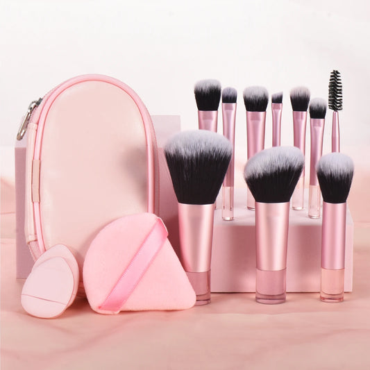 10 piece light pink travel makeup with pouch. Made with synthetic nylon fibers. Great for beginner makeup artists. Comes with blush brush, foundation brush, eyeshadow brush, eyeshadow smudger, eyeshadow detailer brush, angled eyebrow brush, lipstick brush and an eyebrow spoolie.
