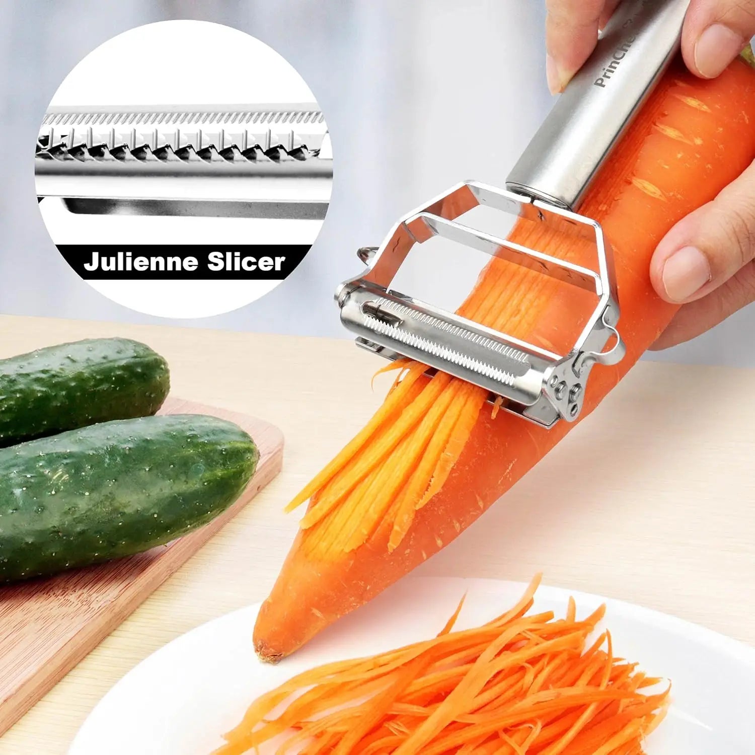 Julienne slicer cutting a carrot with cucumbers on a cutting board in the background.